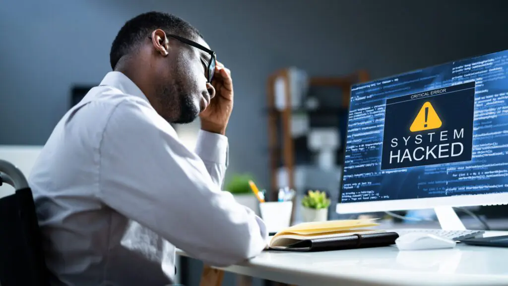 South African small business office with cybersecurity protection icons representing digital threats and security measures.